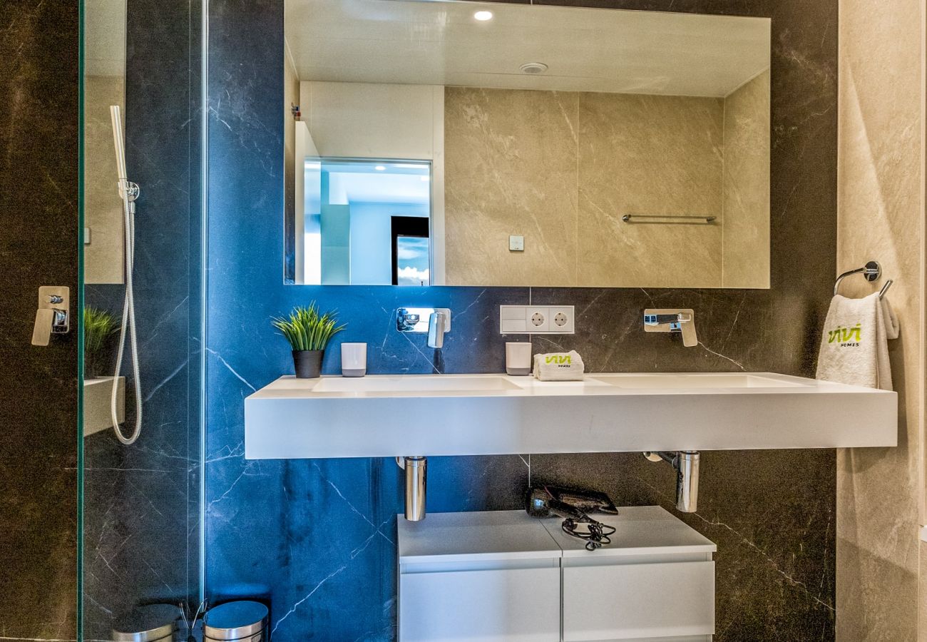 Spain Costa del Sol Torremolinos holiday home Oceana bathroom sink and shower luxury interior 